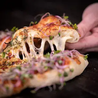 So entwickeln Sie eine Pizzakarte, die zu weniger Lebensmittelverschwendung führen kann.